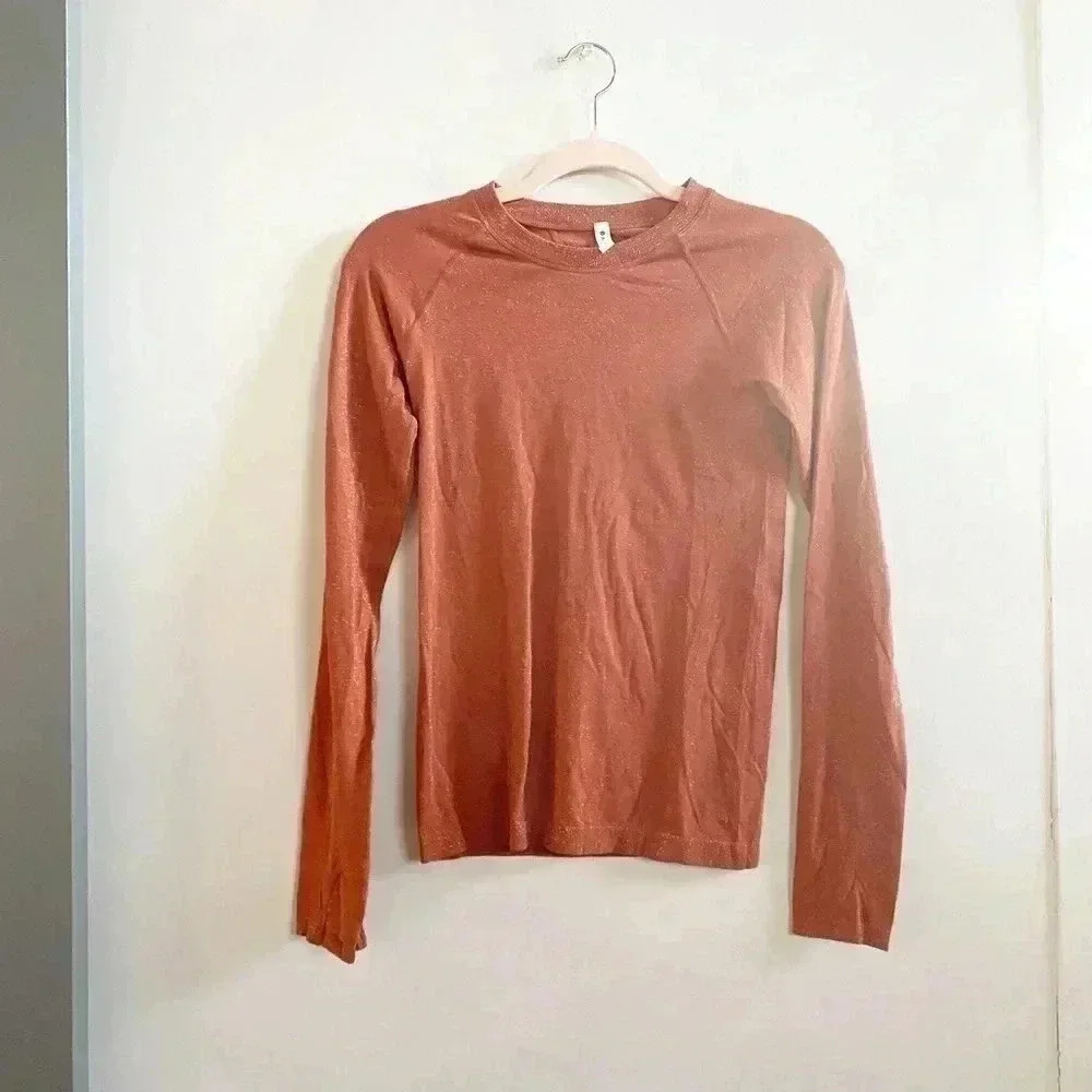 Athleta orange long sleeve shimmer top XS